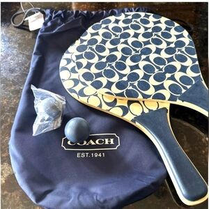 Coach monogram paddle ping pong set handles are light blue brand new never open